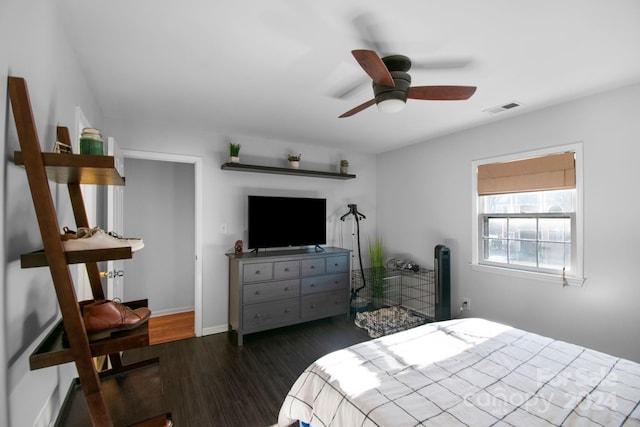 bedroom featuring dark hardwood / wood-style flooring and ceiling fan