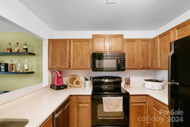 kitchen featuring backsplash and black appliances