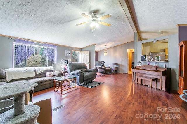 living room featuring vaulted ceiling with beams, ceiling fan, ornamental molding, a textured ceiling, and dark hardwood / wood-style flooring