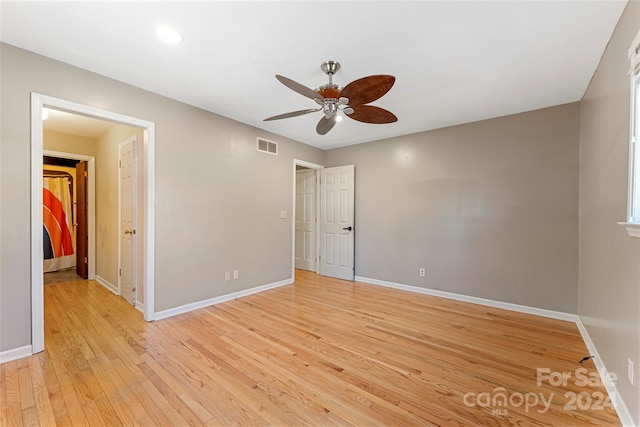 unfurnished bedroom featuring ceiling fan and light hardwood / wood-style flooring