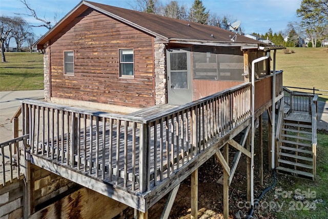 wooden deck with a sunroom