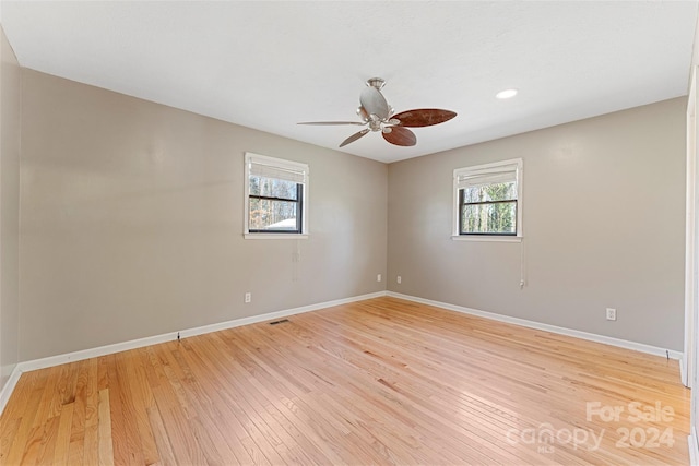 empty room featuring plenty of natural light and light wood-type flooring