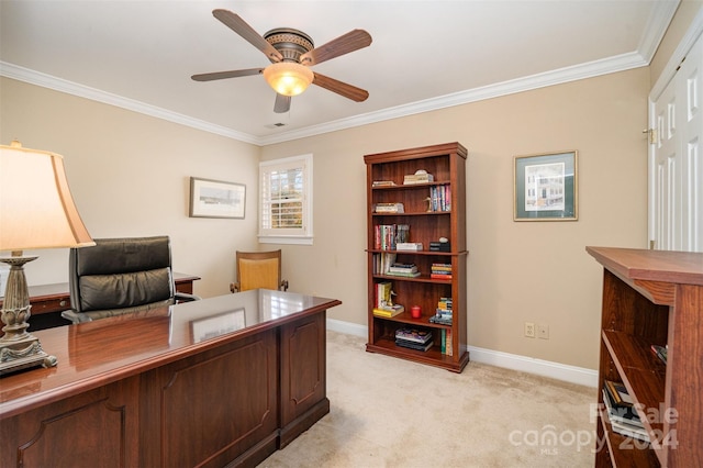 carpeted office space featuring ceiling fan and ornamental molding