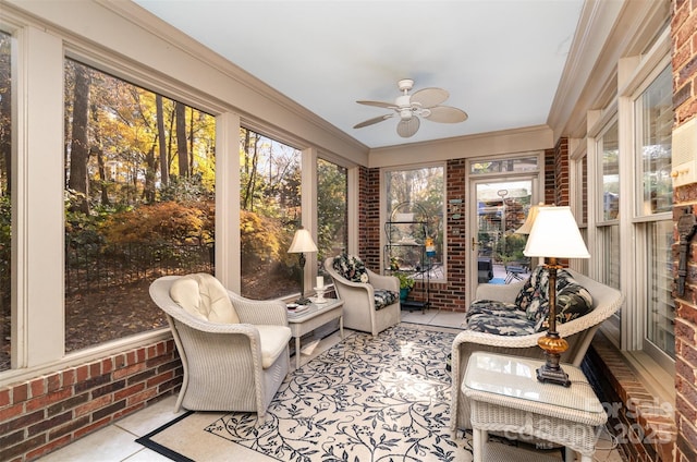 sunroom featuring ceiling fan