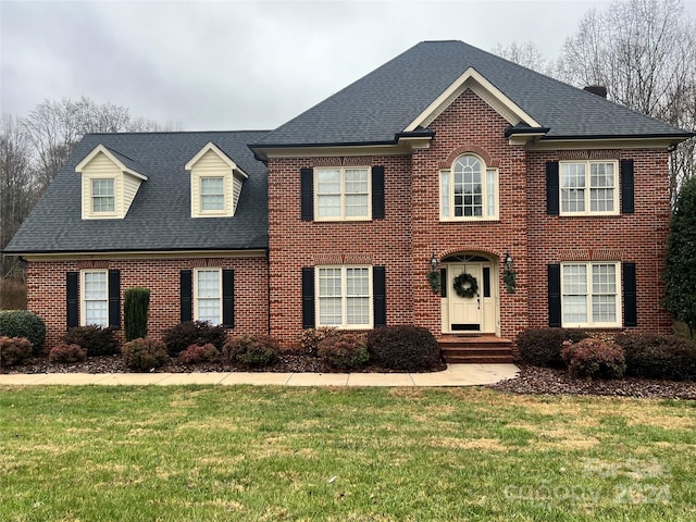 view of front of house with a front lawn