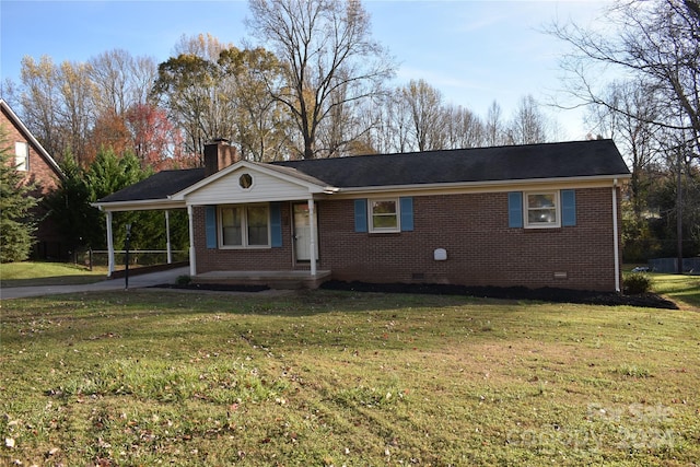 ranch-style home with a carport and a front lawn