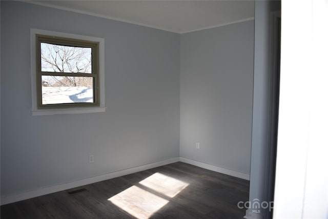 spare room featuring dark hardwood / wood-style flooring