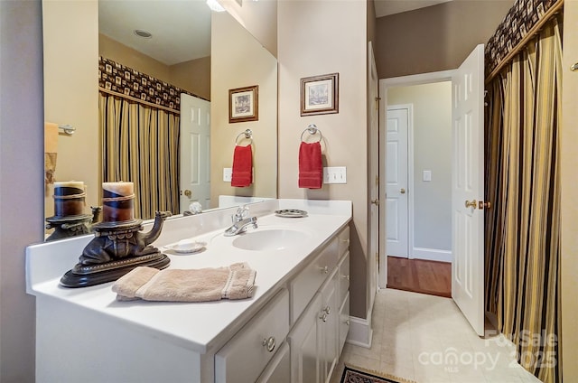 bathroom featuring tile patterned flooring and vanity