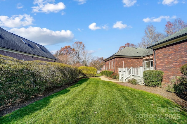 view of yard featuring a wooden deck