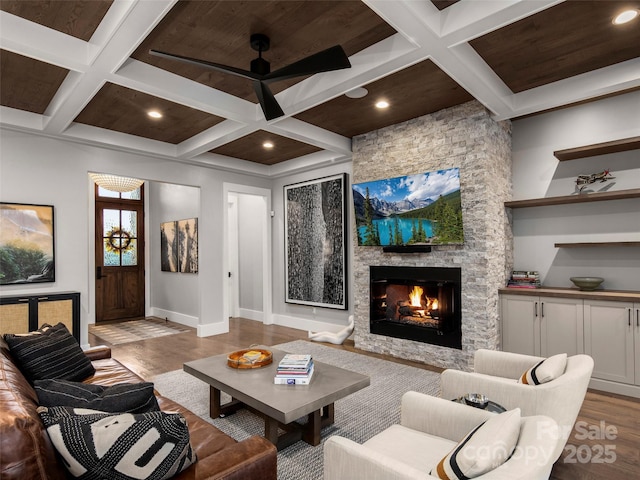 9 Haverhill Way, Arden, NC 28704 - living room with coffered ceiling, wood finished floors, baseboards, a stone fireplace, and recessed lighting