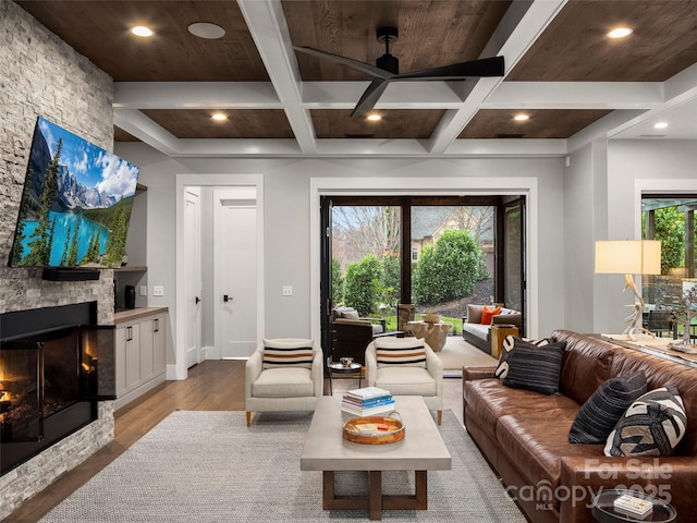 9 Haverhill Way, Arden, NC 28704 - living room featuring wood finished floors, a ceiling fan, coffered ceiling, recessed lighting, and a stone fireplace