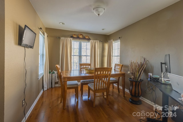 dining space featuring hardwood / wood-style flooring