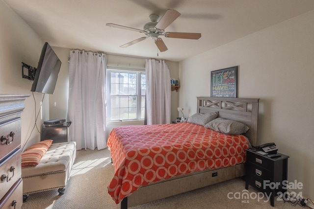 bedroom featuring light carpet and ceiling fan