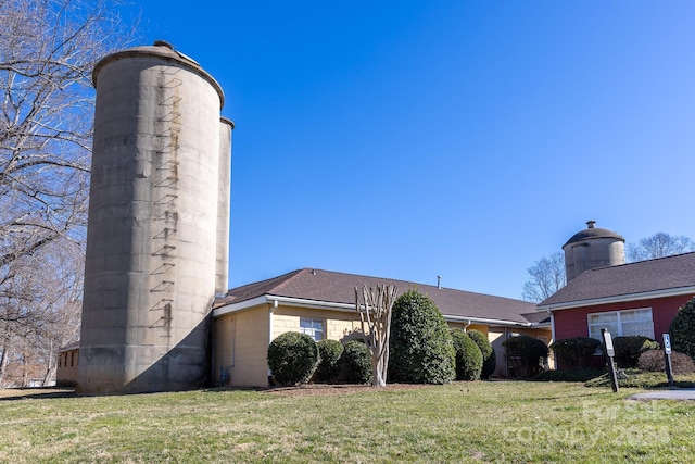 view of home's exterior featuring a yard