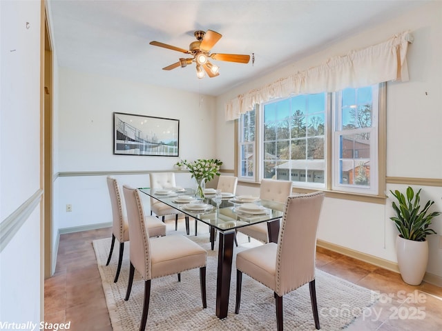 dining room with ceiling fan and light tile patterned floors