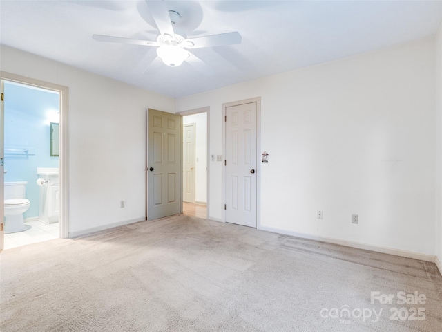 empty room with ceiling fan and light colored carpet