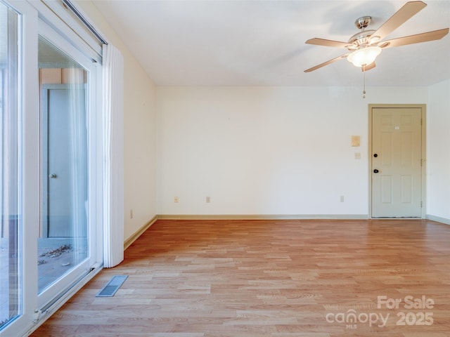 spare room with ceiling fan and light hardwood / wood-style flooring