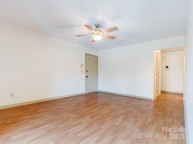 unfurnished room featuring ceiling fan and light hardwood / wood-style flooring