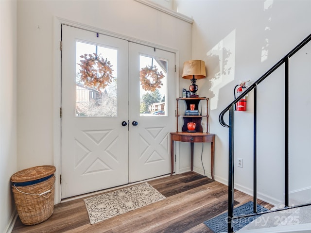 foyer entrance featuring dark wood-type flooring and french doors