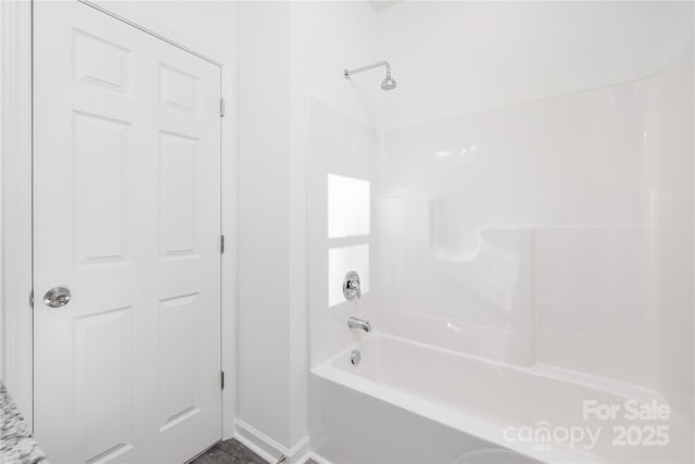 bathroom with shower / tub combination