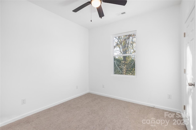 carpeted empty room with ceiling fan