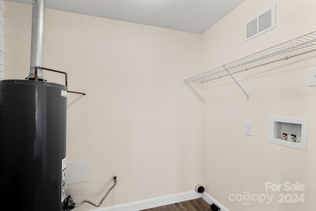 clothes washing area featuring hardwood / wood-style floors, washer hookup, hookup for an electric dryer, and water heater