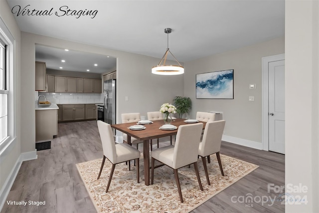 dining room featuring light hardwood / wood-style floors and sink