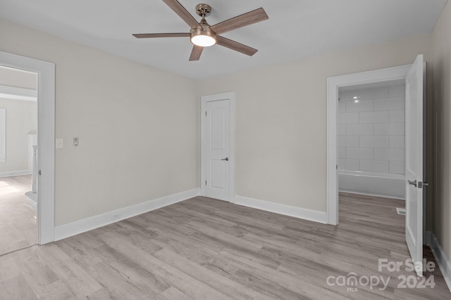 unfurnished bedroom with connected bathroom, a closet, ceiling fan, and light hardwood / wood-style flooring