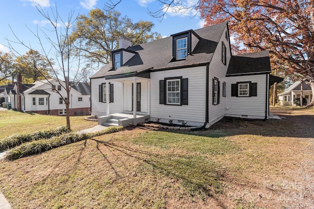 cape cod home with a front yard