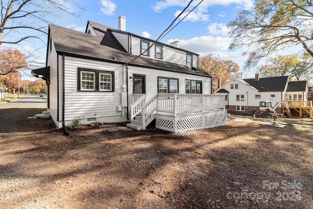 back of property featuring a deck