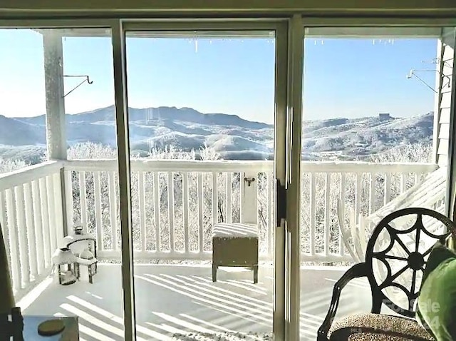 interior space with a mountain view and a healthy amount of sunlight