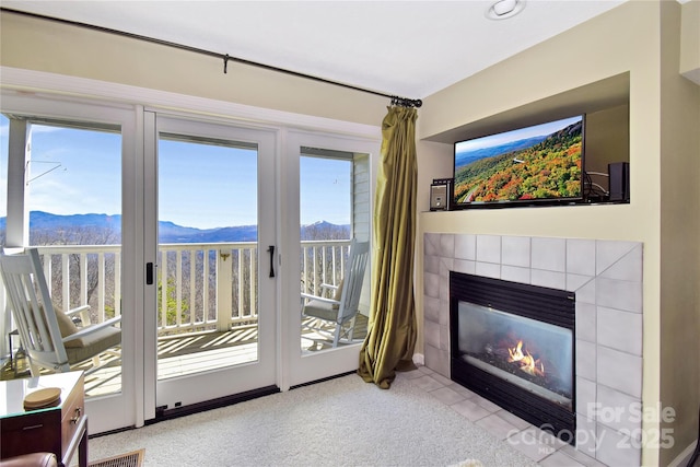 510 Elderberry Ridge Rd Unit E101, Banner Elk, NC 28604 - unfurnished living room featuring a mountain view and a tiled fireplace