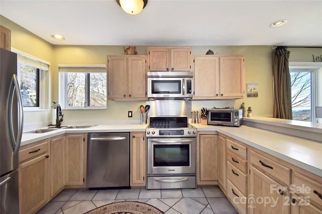 510 Elderberry Ridge Rd Unit E101, Banner Elk, NC 28604 - kitchen featuring appliances with stainless steel finishes, light brown cabinets, a sink, healthy amount of natural light, and recessed lighting
