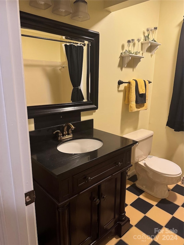 bathroom with vanity and toilet