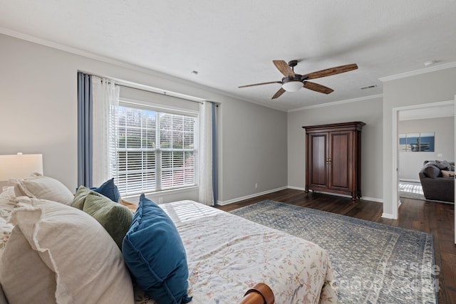 bedroom featuring ceiling fan, dark hardwood / wood-style flooring, a textured ceiling, and ornamental molding