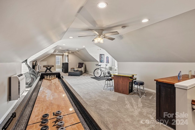 game room with ceiling fan, light carpet, and lofted ceiling