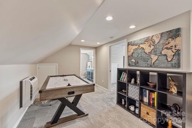 recreation room featuring light carpet and vaulted ceiling