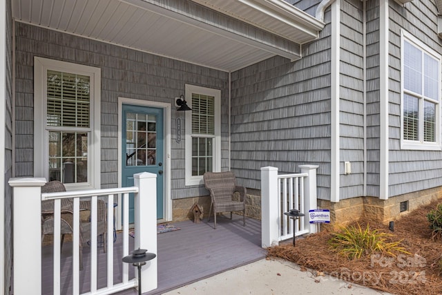 entrance to property with a porch