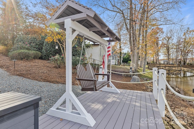 deck featuring a water view