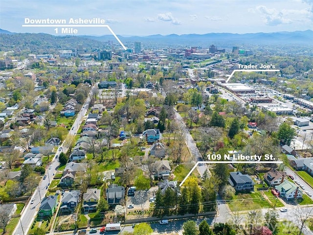 birds eye view of property with a mountain view