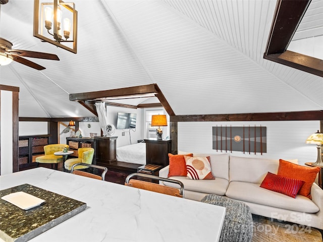 living room featuring ceiling fan and lofted ceiling