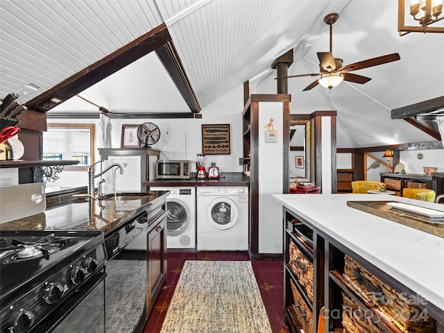 kitchen featuring ceiling fan, dark tile patterned floors, sink, independent washer and dryer, and vaulted ceiling with beams