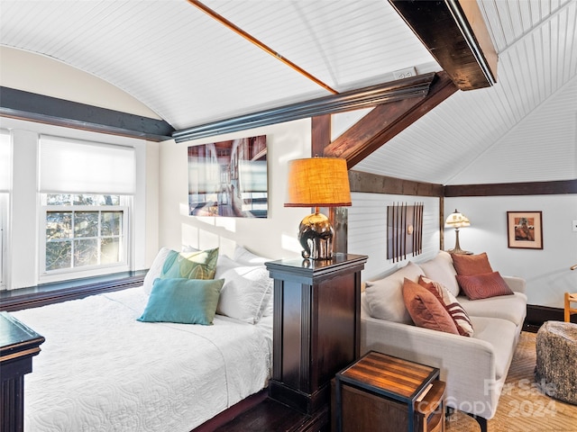 bedroom with hardwood / wood-style floors and lofted ceiling