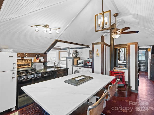 kitchen with lofted ceiling, dark wood-type flooring, black appliances, ceiling fan, and a kitchen island