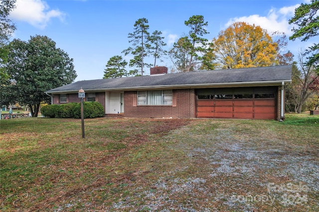 ranch-style house with a front lawn and a garage