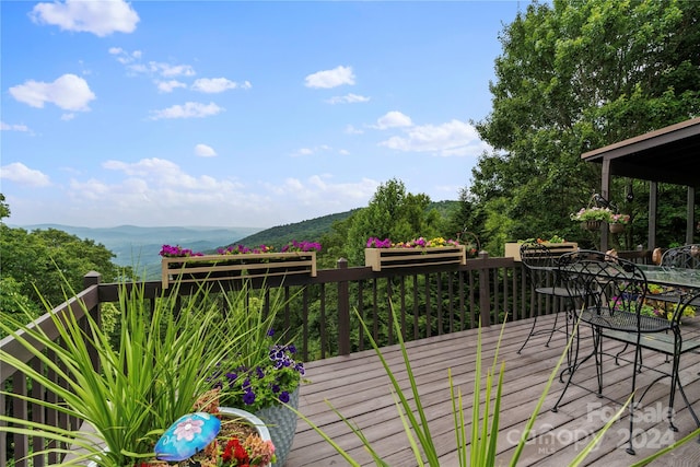 wooden deck featuring a mountain view