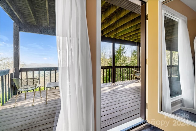 doorway featuring a mountain view and hardwood / wood-style flooring