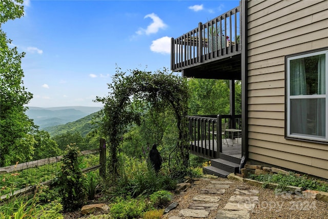 exterior space featuring a deck with mountain view