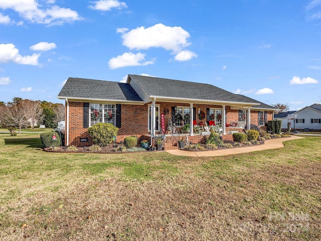 ranch-style house featuring a front lawn