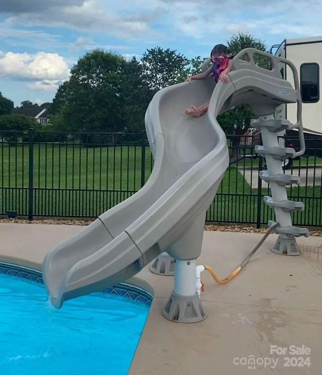 exterior space featuring a yard and a pool